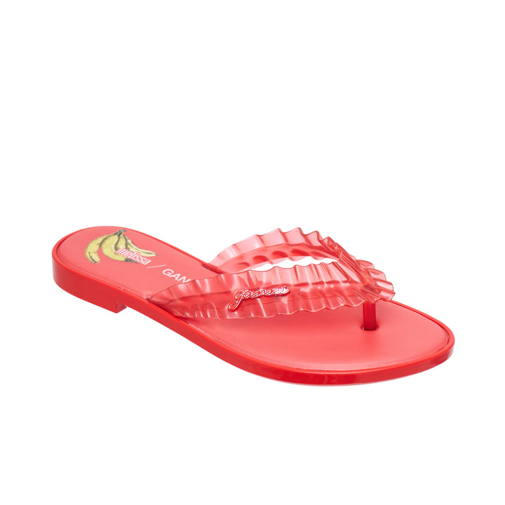Ganni x Melissa red semi-translucent jelly ruffle thong flip flop with layered frill strap and flat moulded sole, side view