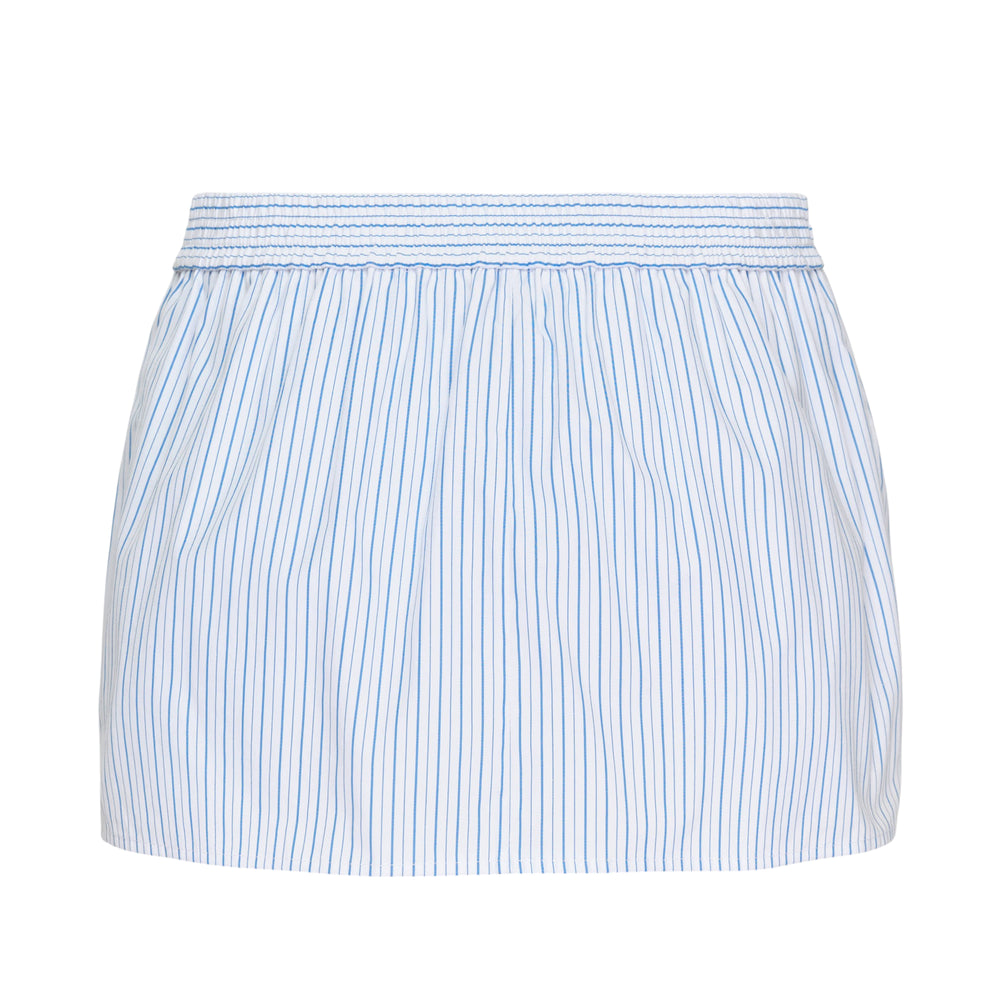Alexander Wang Mid-Rise Mini Boxer Skort in white with blue pinstripe, featuring an elasticated smocked waistband, woven logo label, and front fly detail