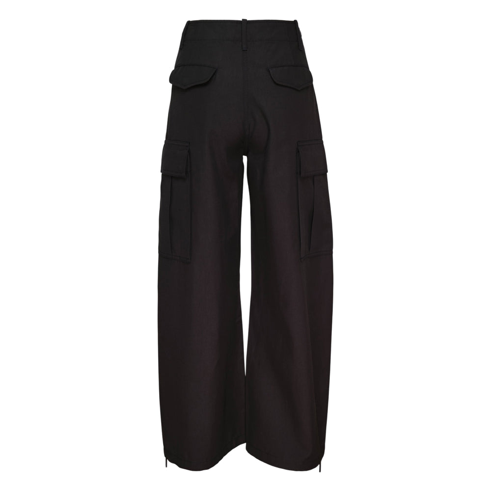 3.1 Phillip Lim Curved Cargo Utility Pants in black — wide-leg silhouette with flap cargo pockets, adjustable waist tabs, knee cut-out detail, and drawstring hem ties