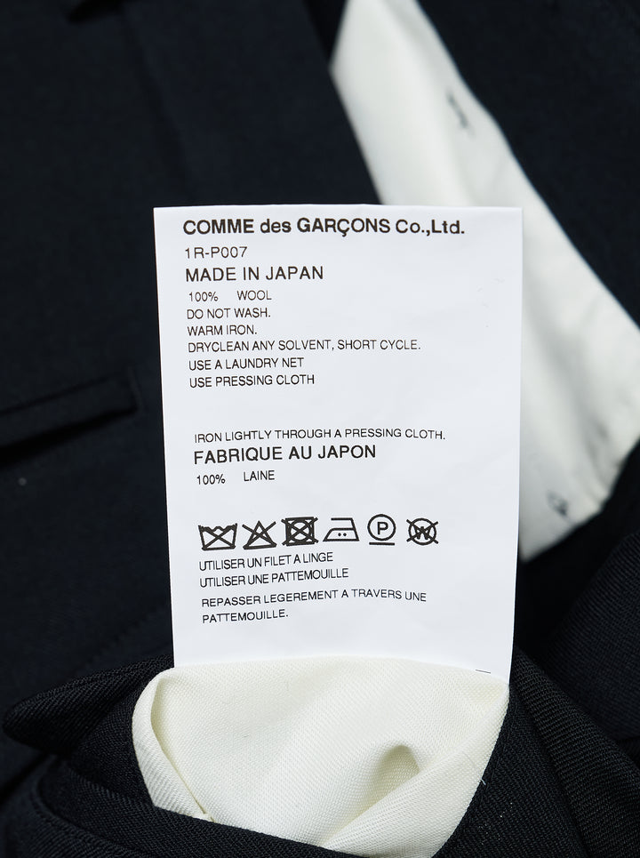 Comme des Garçons Black wool gabardine wide-leg shorts in black, featuring sculptural curved oversized patch pockets on the front panels and a high-rise tailored waistband with single button closure - view 3