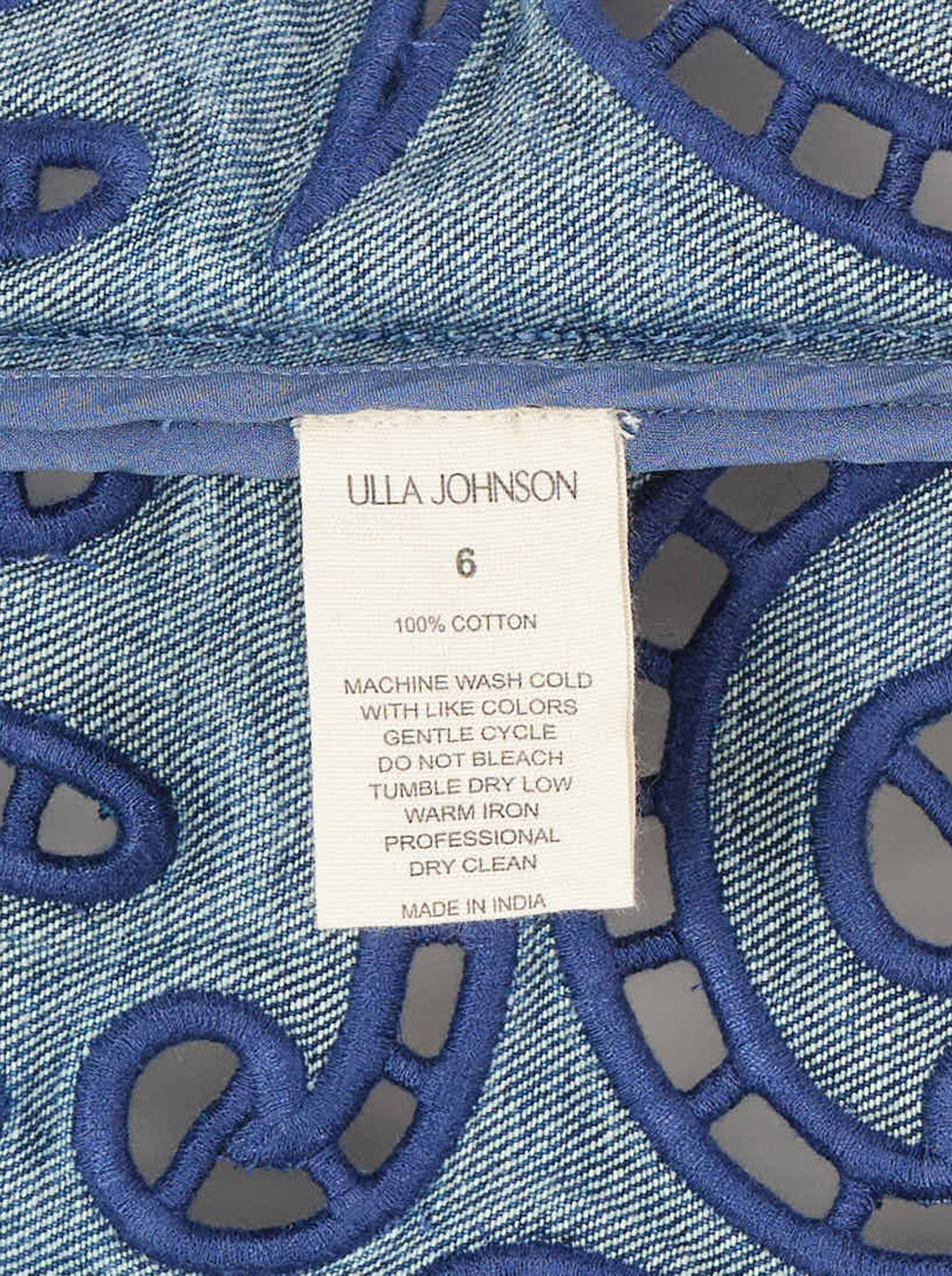 Ulla Johnson Jane Eyelet Denim Dress in washed blue denim with spaghetti straps, empire waist and indigo cutwork embroidery along the scalloped hem - view 3