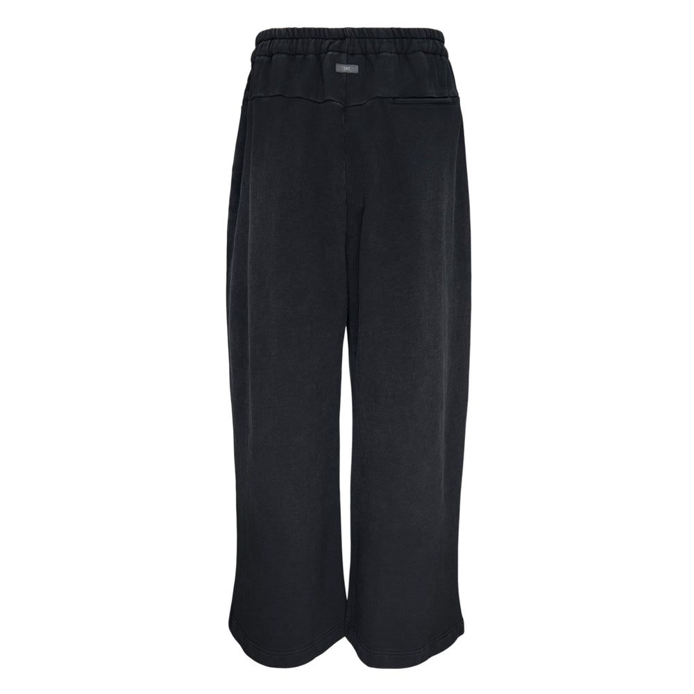 TEAM WANG design Washed Baggy Sweatpants in washed black with wide-leg silhouette, elasticated drawstring waist, pressed pleats, and D-ring hardware detail
