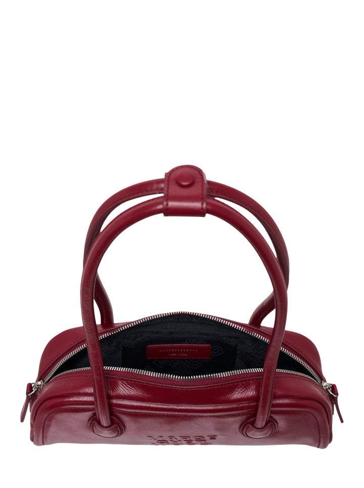 Marge Sherwood Soft Boston EW Mini shoulder bag in deep burgundy crinkle-glazed leather with arched double top handles and embossed logo, front view on white background - view 3