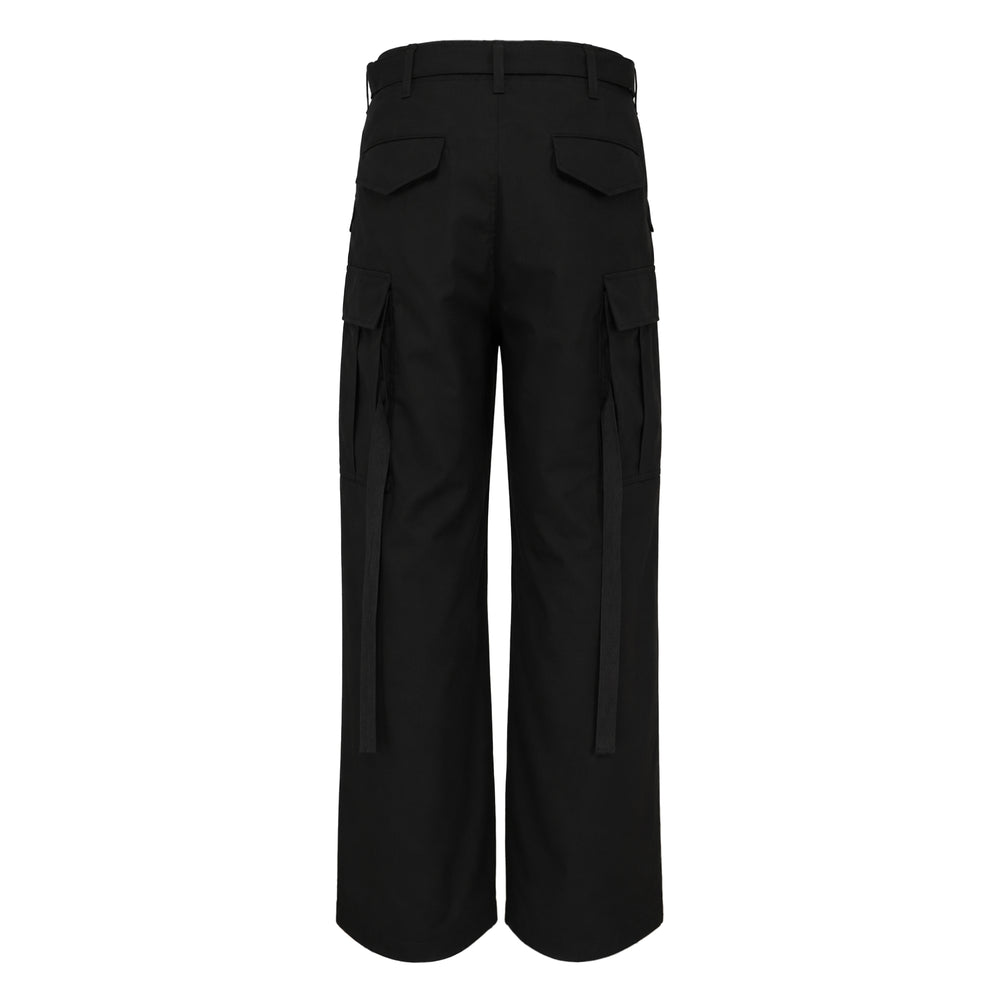sacai Cotton Nylon Oxford Pants in black, featuring a wide-leg silhouette, integrated belted waist with silver-tone buckle, and cargo side pockets