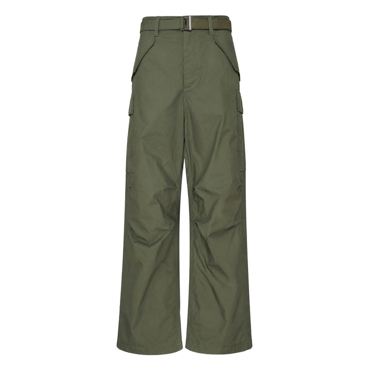 sacai Cotton Nylon Oxford Pants in black, featuring a wide-leg silhouette, integrated belted waist with silver-tone buckle, and cargo side pockets