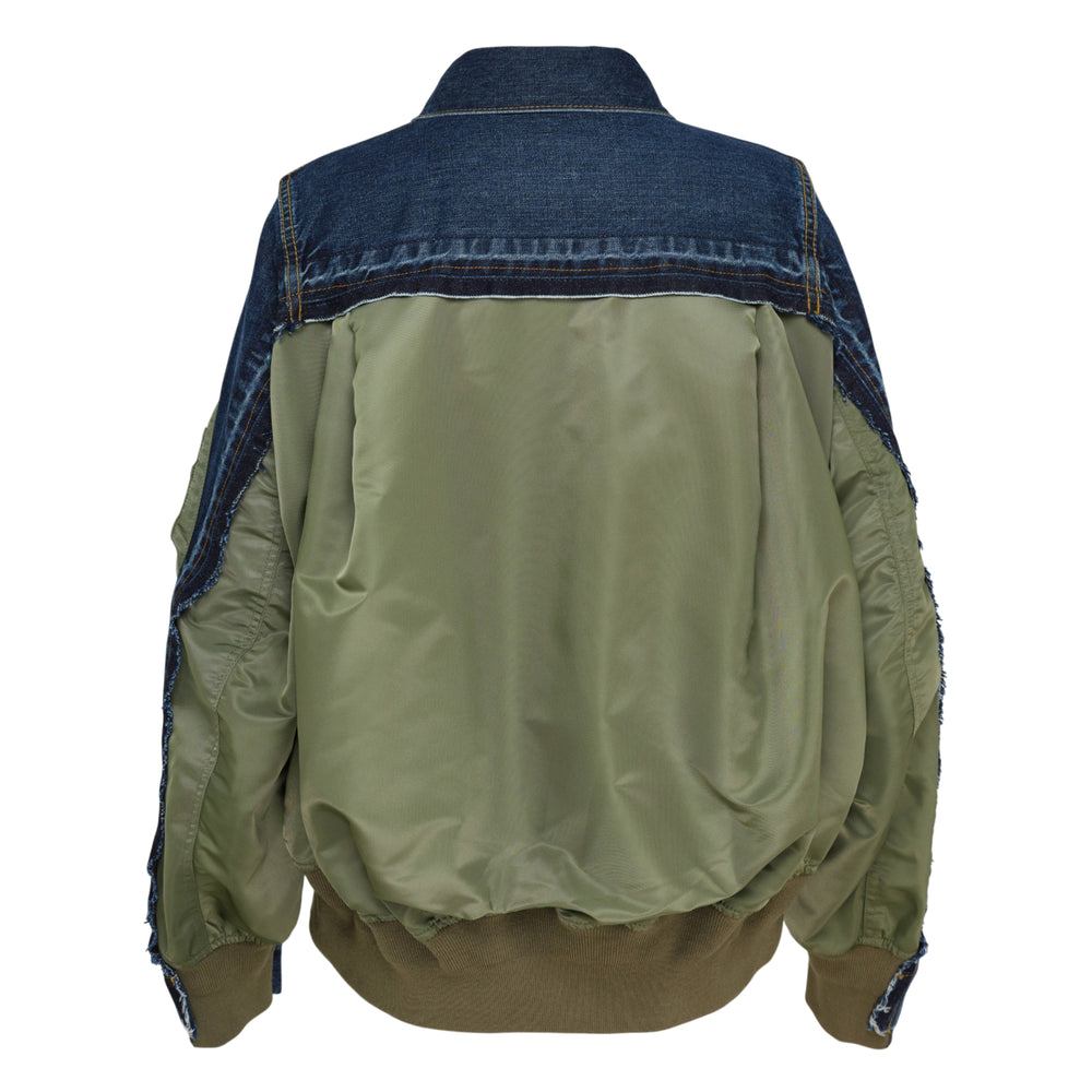 sacai Denim x Nylon Twill Jacket in washed black, front view, featuring nylon twill sleeve panels, snap-button placket, twin chest pockets, and a utility zip pocket on one sleeve