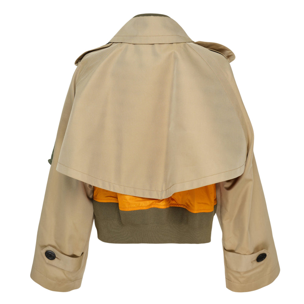 sacai Cotton Gabardine x Nylon Twill Blouson in beige and olive — cropped hybrid trench-bomber with double-breasted black buttons, epaulettes, zip utility sleeve pocket, and contrast nylon bomber base