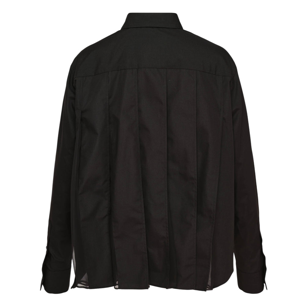 sacai Cotton Poplin Shirt in black, featuring a concealed snap placket, point collar, chest patch pocket, long sleeves with barrel cuffs, and a curved high-low hem