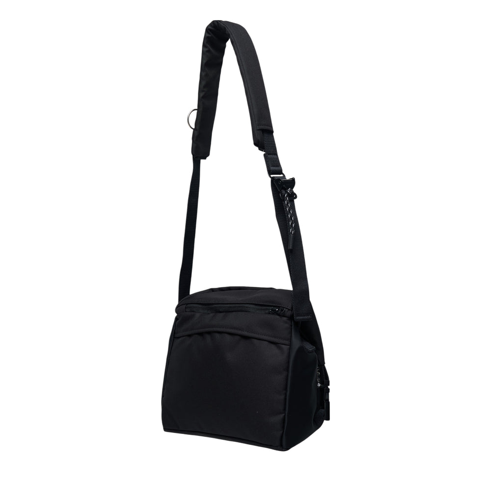 sacai black nylon utility crossbody shoulder bag with multiple zip pockets, snap-button pocket, and adjustable padded strap, shown on white background