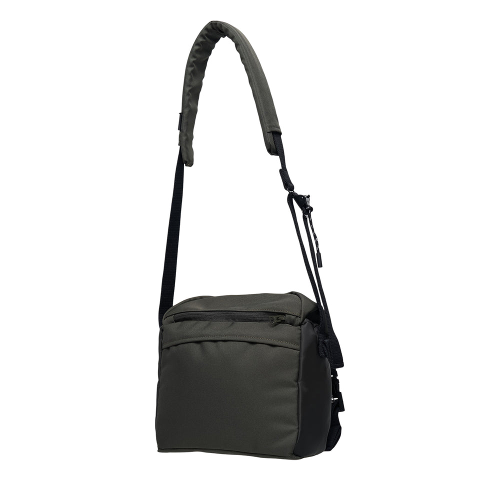 sacai black nylon utility crossbody shoulder bag with multiple zip pockets, snap-button pocket, and adjustable padded strap, shown on white background