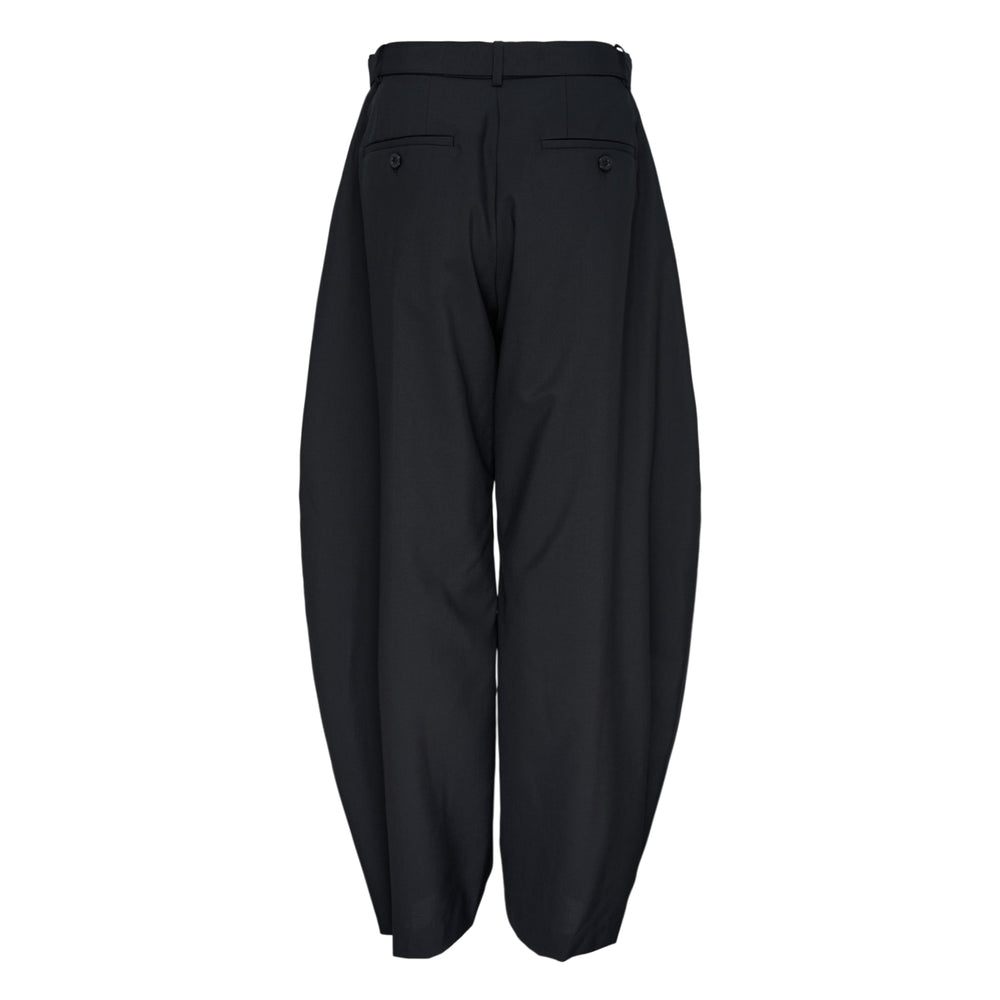 sacai Belted Suiting Pants in black, featuring a sculptural barrel-leg silhouette, high-rise waist, and integrated matte-buckle belt, displayed on a white background