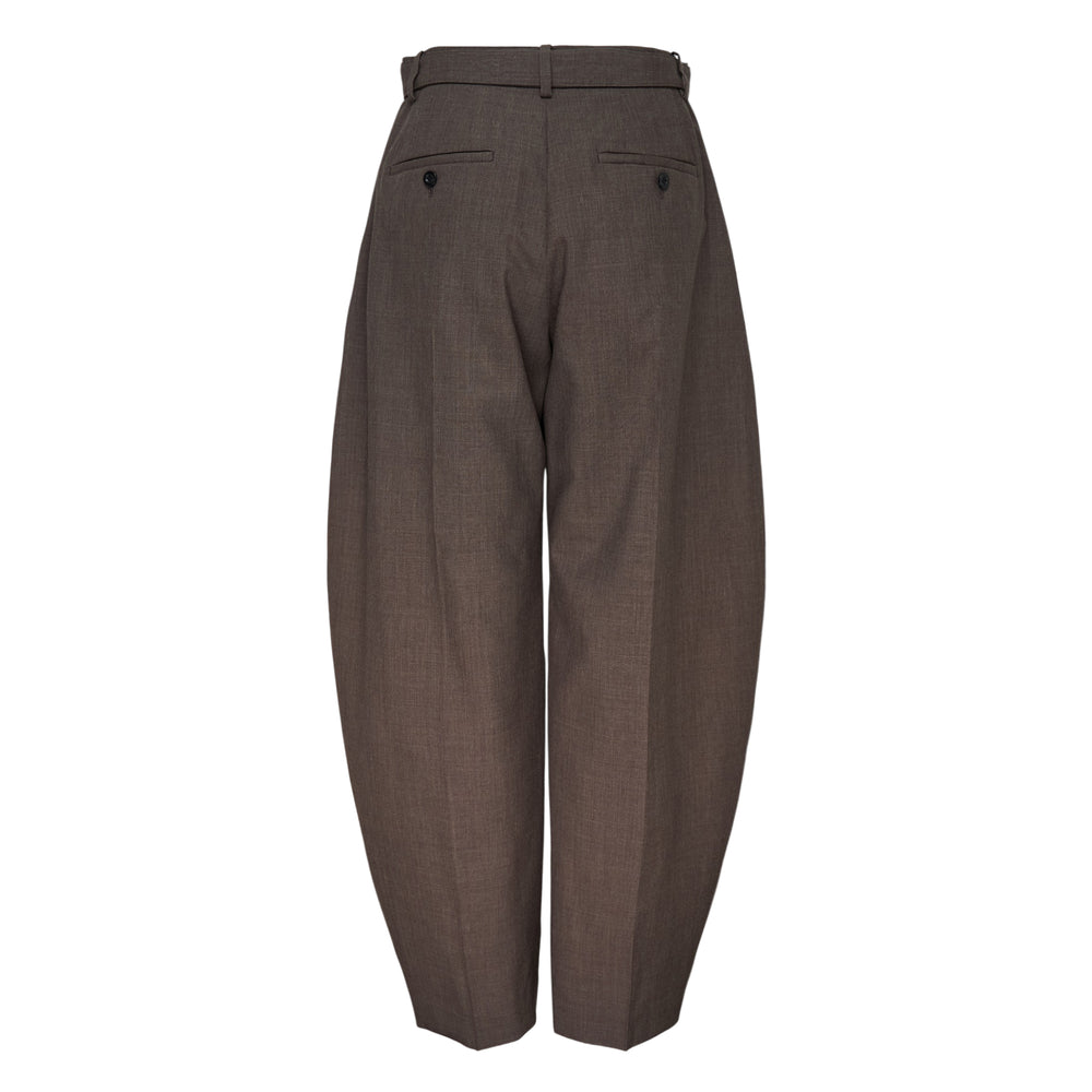 sacai Belted Suiting Pants in black, featuring a sculptural barrel-leg silhouette, high-rise waist, and integrated matte-buckle belt, displayed on a white background