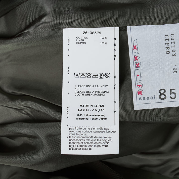 sacai Cotton Weather Cargo Shorts in olive green with wide-leg silhouette, front pleats, patch cargo pockets, and integrated buckle belt - view 3