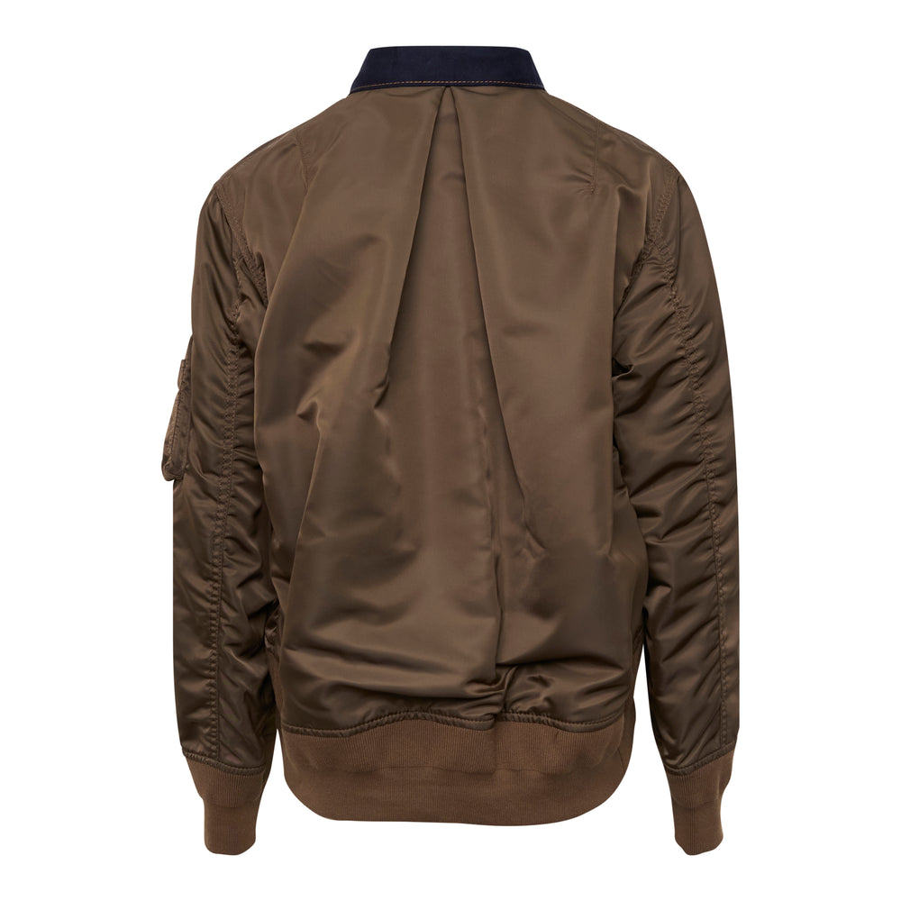 sacai Denim Bomber Blouson in navy indigo with olive nylon sleeves, contrast orange topstitching, snap-button front closure, and MA-1 zip pocket on sleeve, front view