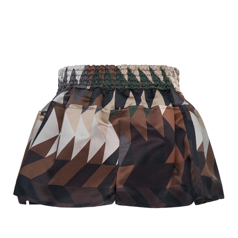 sacai x Being geometric camouflage boxing shorts with smocked high-rise waistband, embroidered logo patch, and pleated flared hem