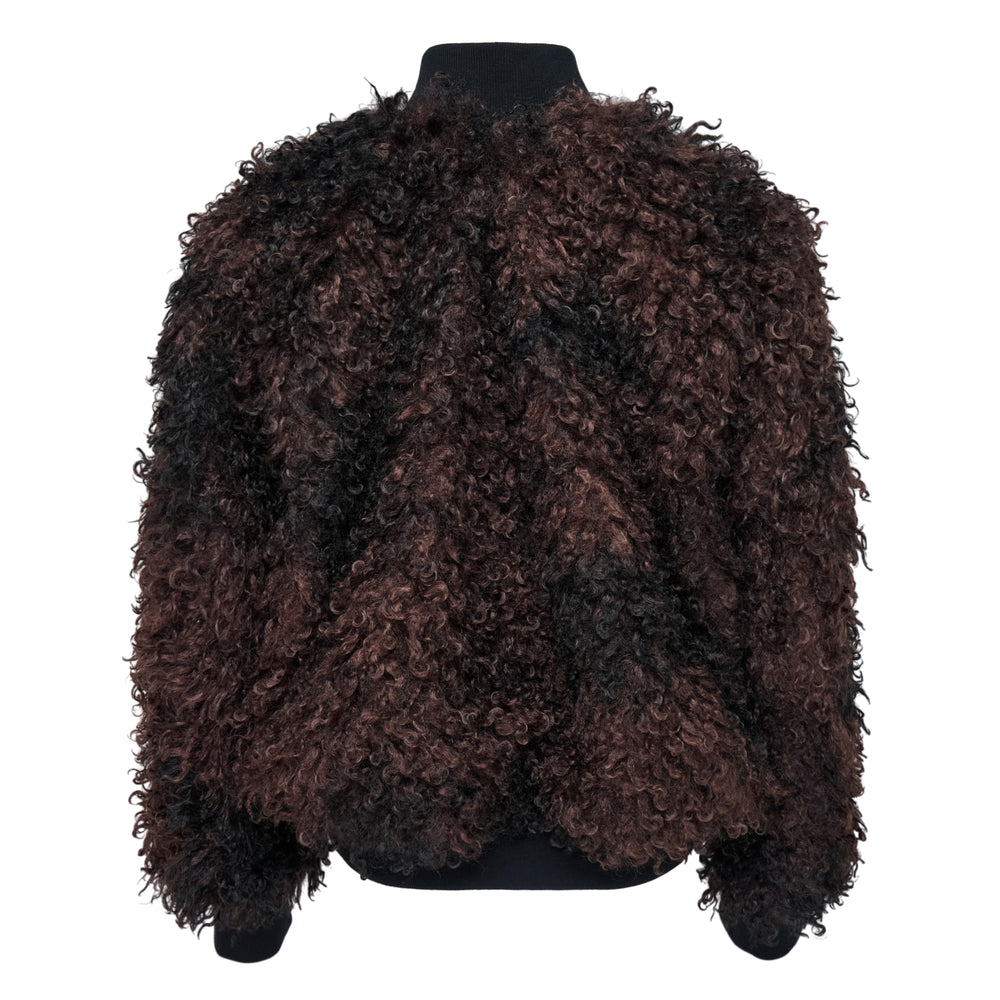 sacai Curly Faux Fur Blouson in dark brown and black, featuring voluminous curly faux fur panels over a nylon MA-1 bomber shell with silver zip closure and ribbed cuffs