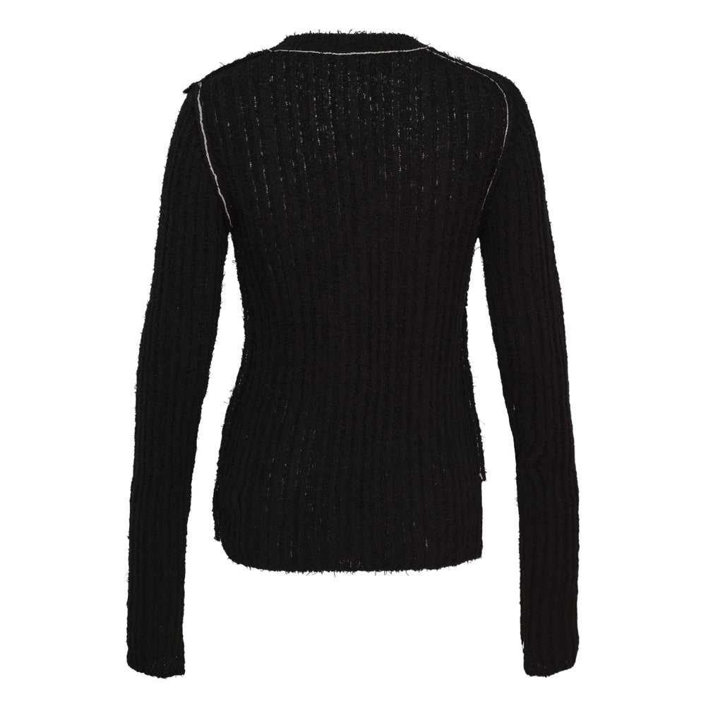 Y's black ribbed knit cardigan with diagonal asymmetric button placket and contrast topstitching, featuring a deconstructed frayed hem and fitted silhouette