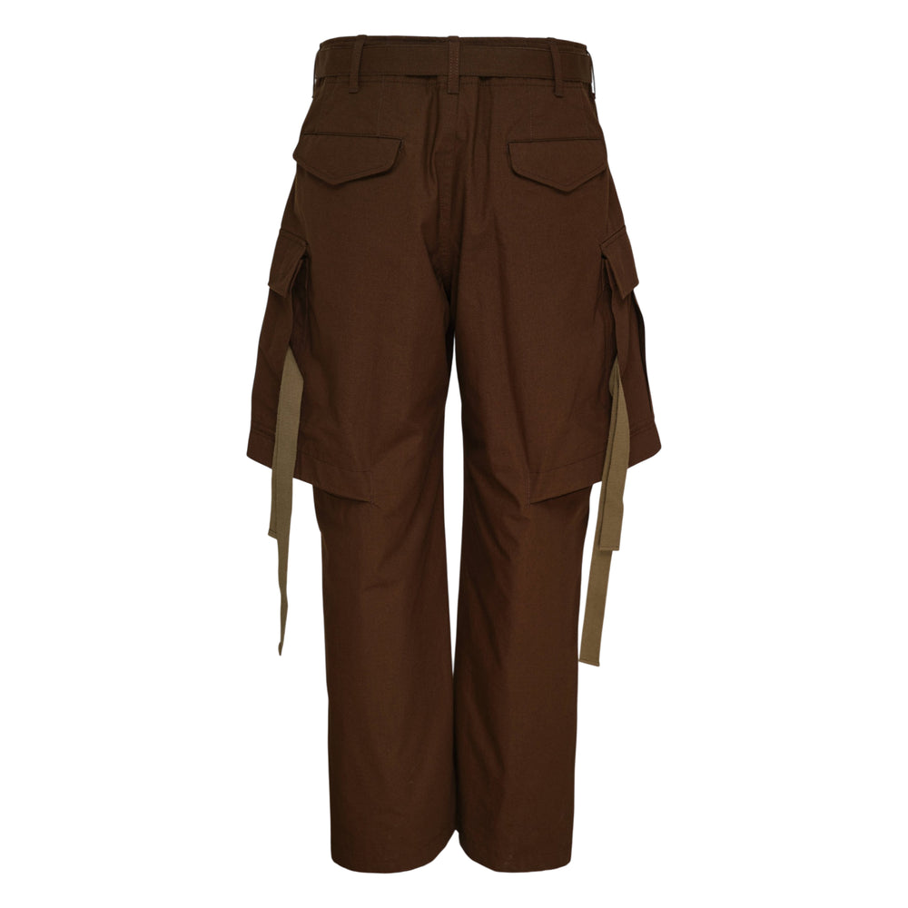 sacai Rip Stop Cargo Pants in dark brown with oversized pleated cargo pockets, contrast olive webbing straps, and a two-tone buckle belt, displayed flat on a white background