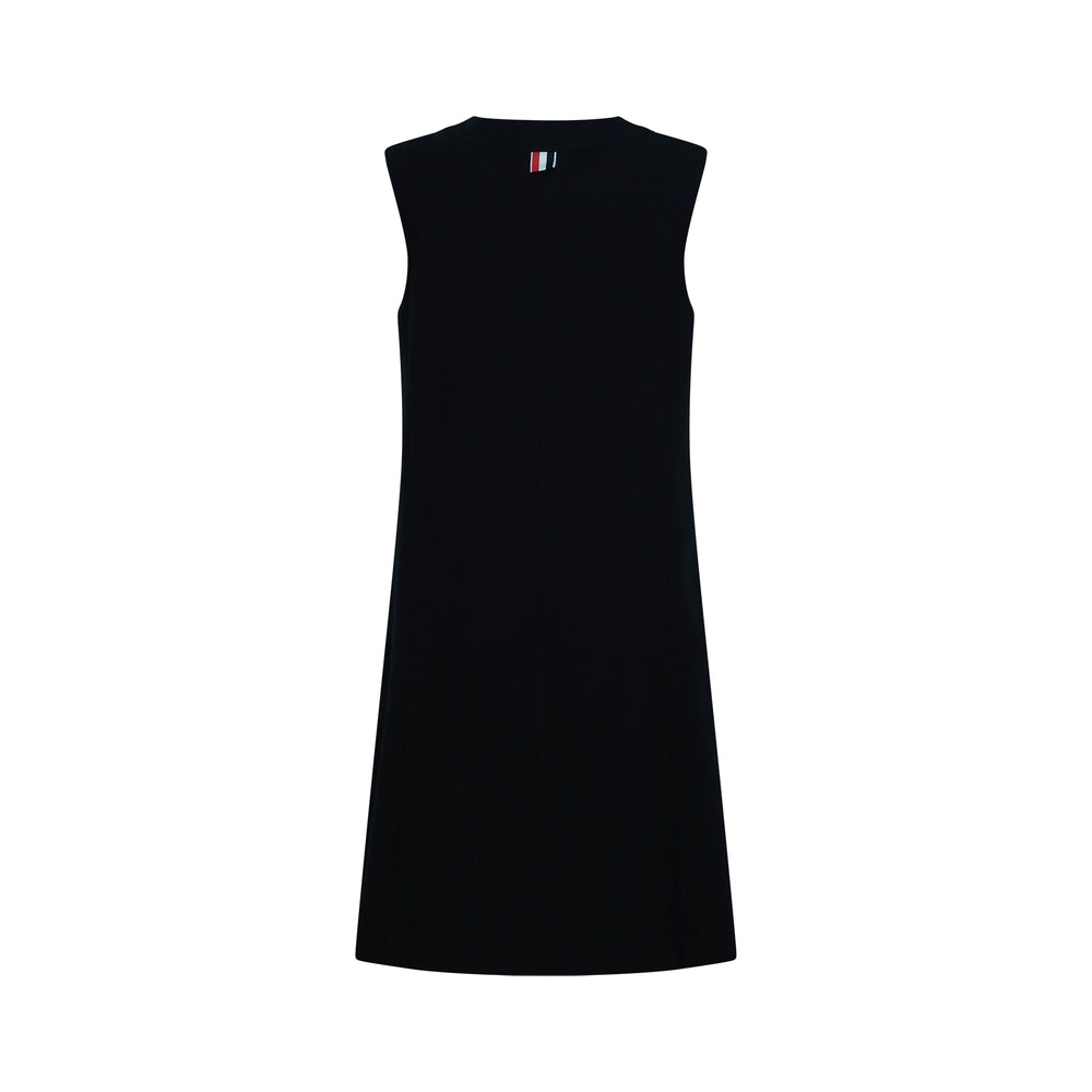 Thom Browne navy V-neck cardigan dress with gold embossed buttons, signature red, white, and blue grosgrain ribbon trim at neckline, and gold-button flap pockets at hip - view 2
