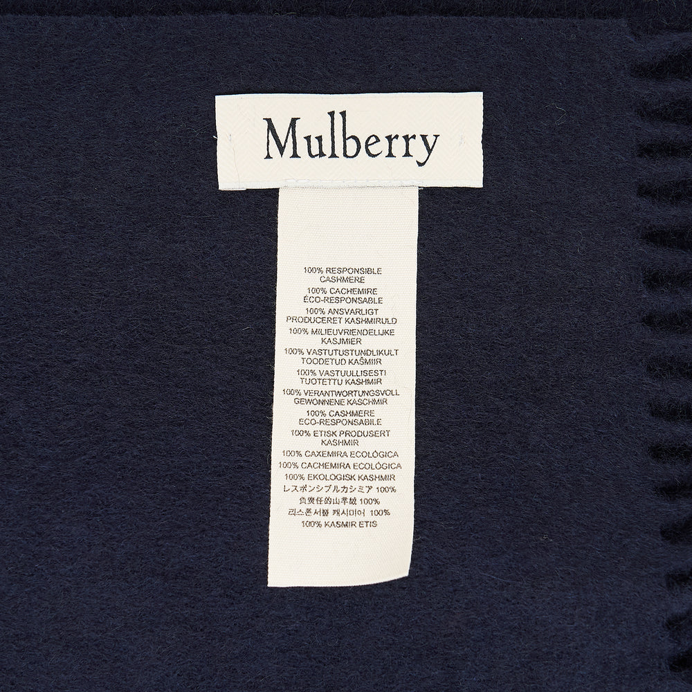 Mulberry navy cashmere scarf laid flat, 30 x 195cm, with fringe trim at both ends and tonal embroidered logo