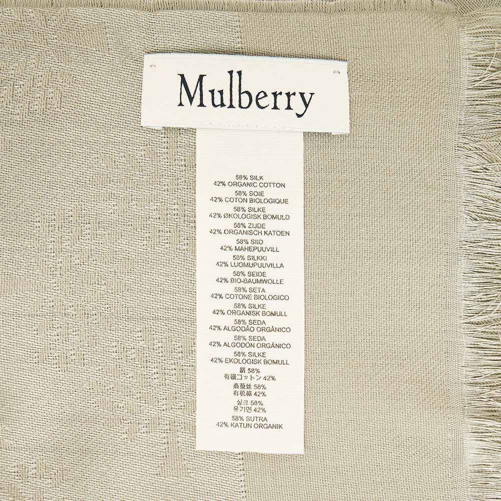 Mulberry Tree Rectangular Scarf in black, laid flat to show an all-over tonal jacquard tree motif, fringe hem trim, and Mulberry wordmark woven along the border
