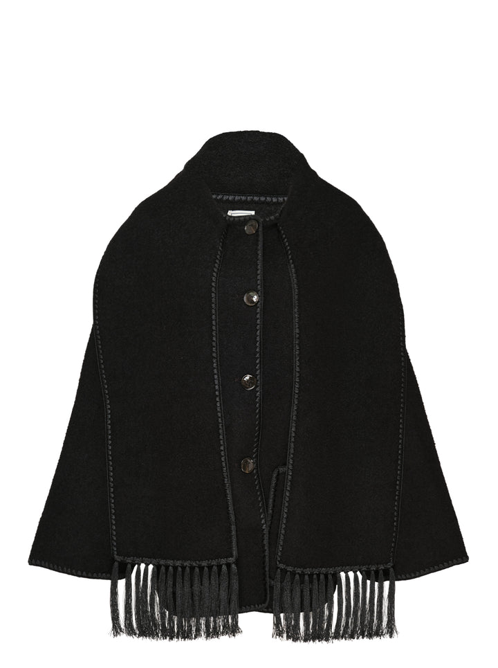 Toteme Embroidered Scarf Jacket in black wool with tonal whipstitch trim, snap-button placket, patch pocket, and long fringe tassel hem — flat lay on white background