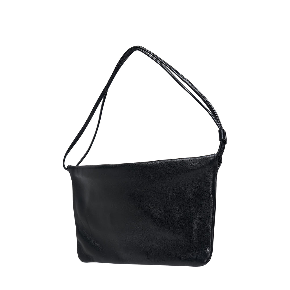 Nothing Written Nella Strap Mini Bag in black pebbled leather with slim double shoulder strap and matte hardware adjuster, front view on white background