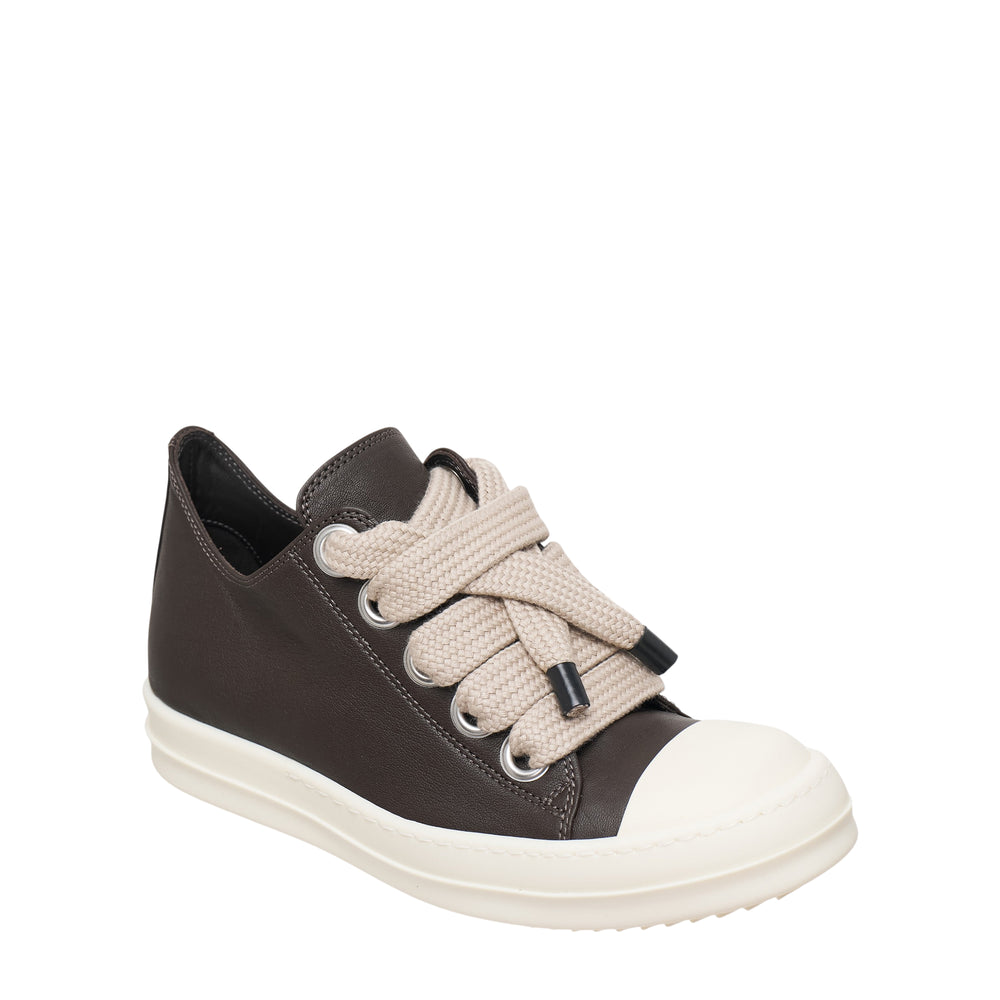 Rick Owens Jumbo Lace Low Sneaker in dark grey smooth leather with oversized braided off-white rope laces, silver eyelets, and a chunky off-white platform rubber sole, shot in profile on a white background