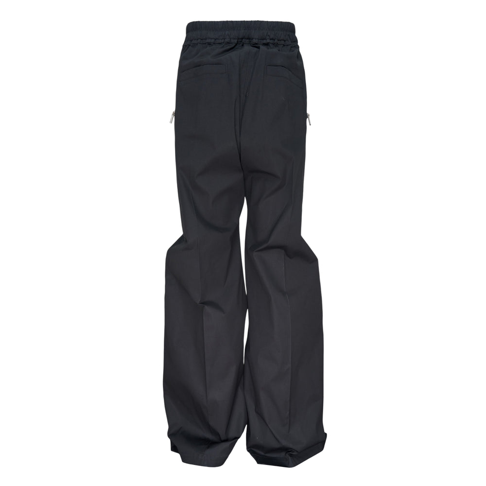 Rick Owens Haizer Belas Heavy Poplin Pants in dark navy, featuring an exaggerated drop-crotch silhouette, exposed silver zip detailing on both thighs, and a cream drawstring waistband