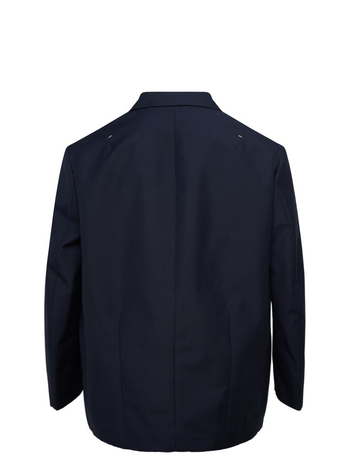 Jil Sander navy fil-a-fil wool jacket with camp collar, four-button fastening, and curved flap pockets with metal hardware — front view on white background - view 2