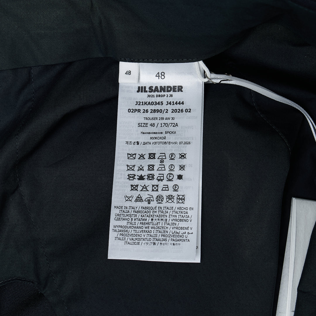 Jil Sander black wool mohair wide-leg trousers with front crease and adjustable back waistband buckle, flat-front view