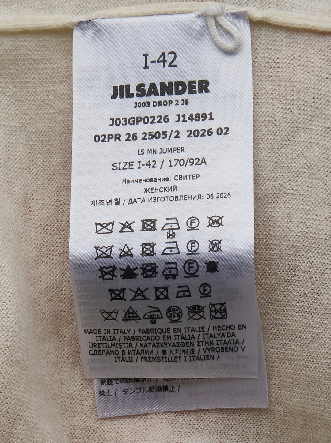 Jil Sander ivory long sleeve mock-neck cashmere jumper with sculptural chevron pleated chest detail, displayed flat on white background - view 3