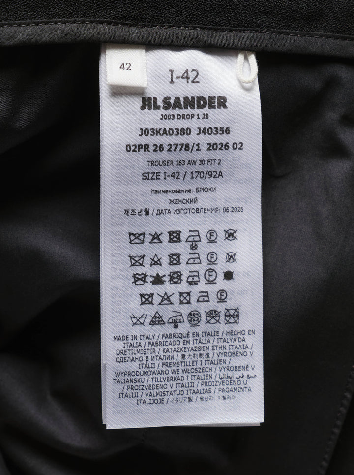 Jil Sander black wide-leg trousers with a cascading draped panel and button-fastened waistband, shown from the front - view 3