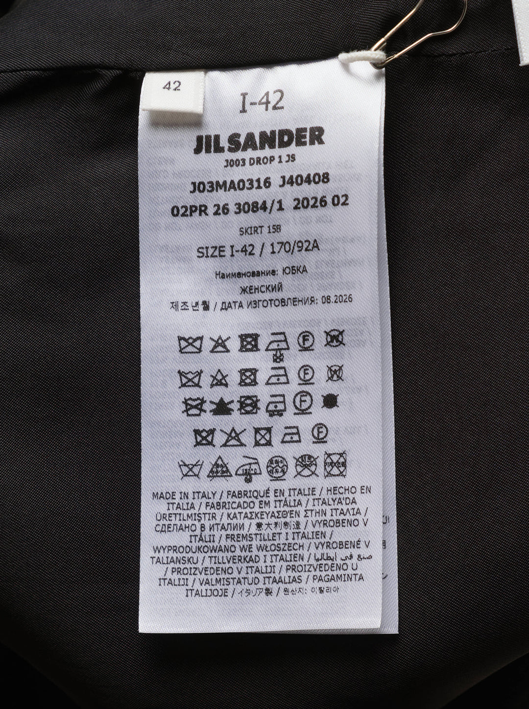 Jil Sander heavy textured sablé black midi skirt with dramatic asymmetric cut-out hem and high-rise waistband, displayed on white background - view 3