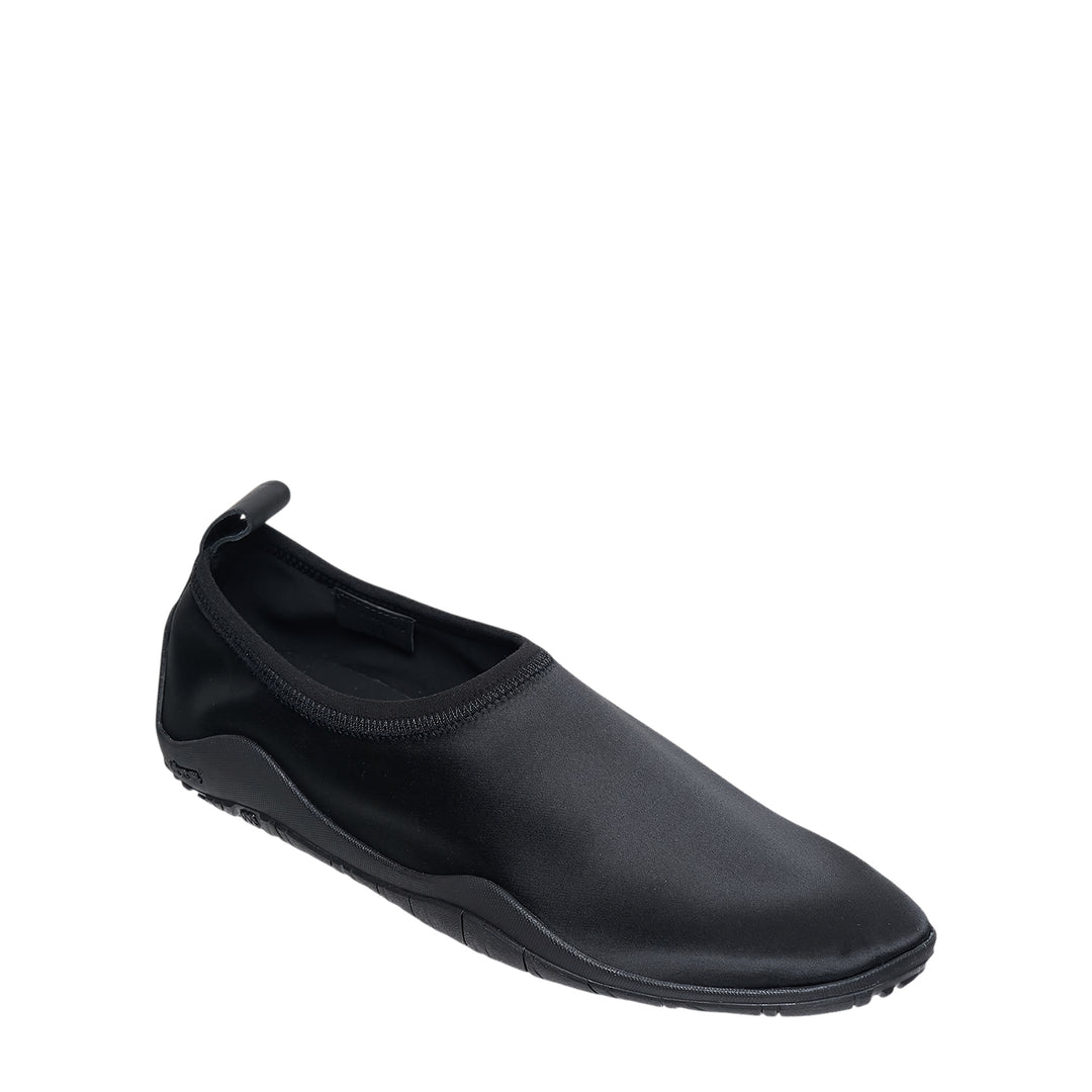Jil Sander Elbe Slip On Satin Stretch water shoe in black, featuring a form-fitting stretch upper, rear pull tab, and Vibram rubber outsole, shown in profile view