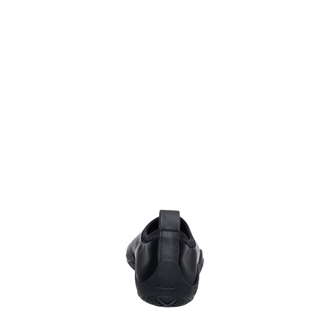 Jil Sander Elbe Slip On Satin Stretch water shoe in black, featuring a form-fitting stretch upper, rear pull tab, and Vibram rubber outsole, shown in profile view