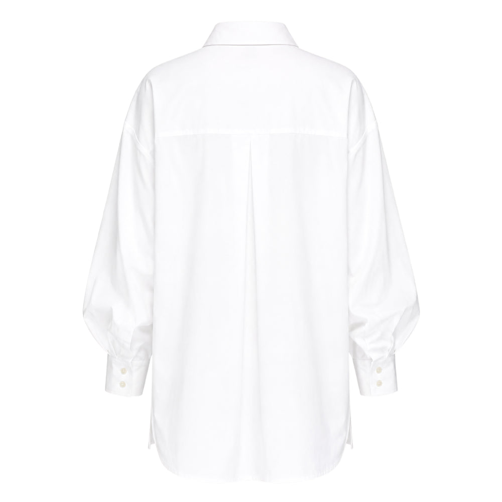 Carolina Herrera Clara Shirt in white cotton with voluminous bishop sleeves, point collar, and pearlescent button-front placket, displayed flat on a white background