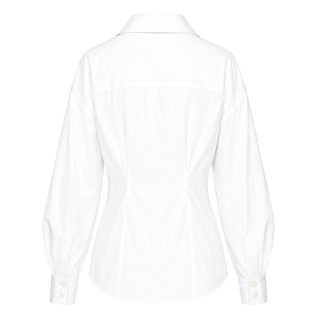 Carolina Herrera white fitted waist long sleeve collared shirt with bishop sleeves, cinched waist seaming, and concealed button front placket, displayed on a flat lay against a white background
