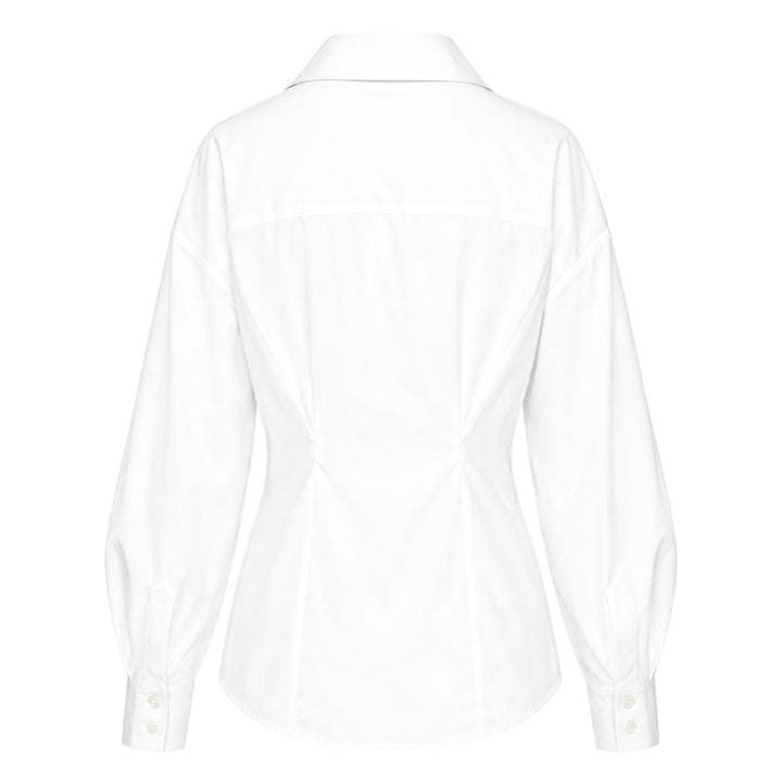 Carolina Herrera white fitted waist long sleeve collared shirt with bishop sleeves, cinched waist seaming, and concealed button front placket, displayed on a flat lay against a white background