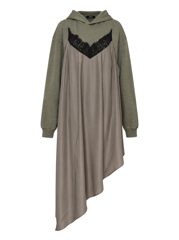Olive green oversized hoodie layered with a taupe satin slip dress featuring black lace neckline trim and an asymmetric hem