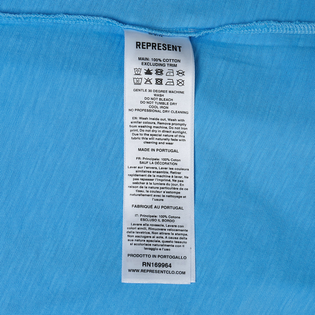 Represent Owners Club T-Shirt in sky blue with tonal collegiate arch graphic, relaxed oversized fit, flat lay product shot