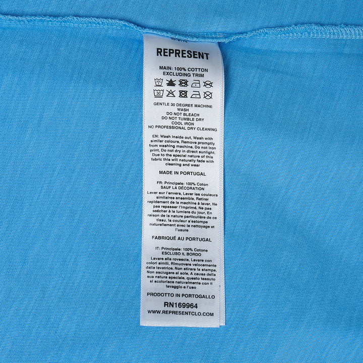 Represent Owners Club T-Shirt in sky blue with tonal collegiate arch graphic, relaxed oversized fit, flat lay product shot