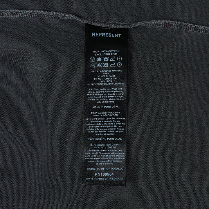 Represent Owners Club T-Shirt in washed black, rear view showing bold back graphic print with 'Represent Owners Club – Powered by Enthusiasts for Enthusiasts' text