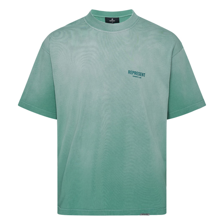 Represent Owners Club T-Shirt in washed black, rear view showing bold back graphic print with 'Represent Owners Club – Powered by Enthusiasts for Enthusiasts' text