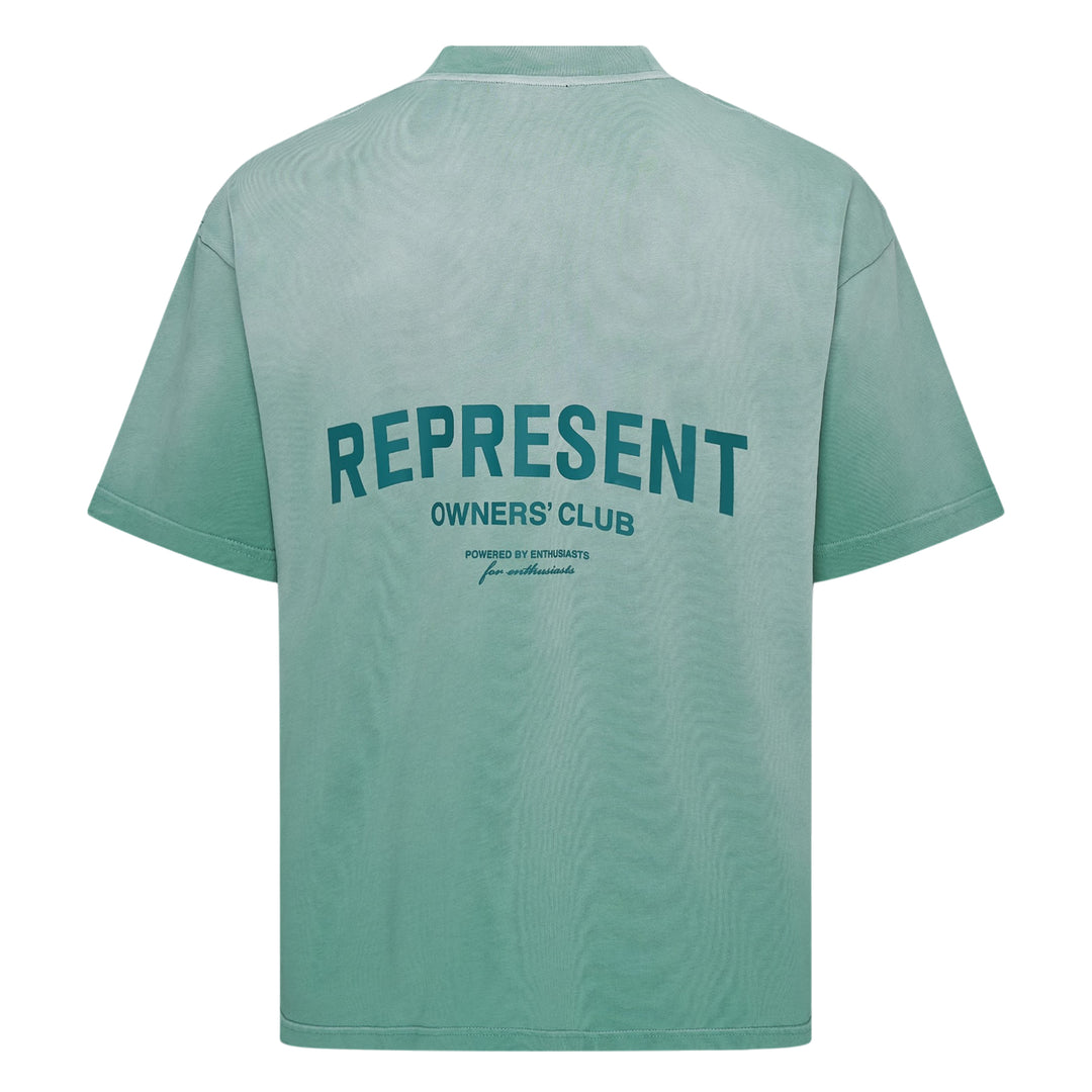 Represent Owners Club T-Shirt in washed black, rear view showing bold back graphic print with 'Represent Owners Club – Powered by Enthusiasts for Enthusiasts' text