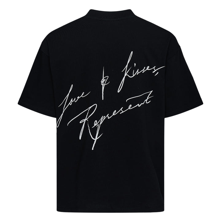 Back view of Represent Love & Kisses Tee in black, featuring a white cursive script graphic reading 'Love & Kisses, Represent' across the back