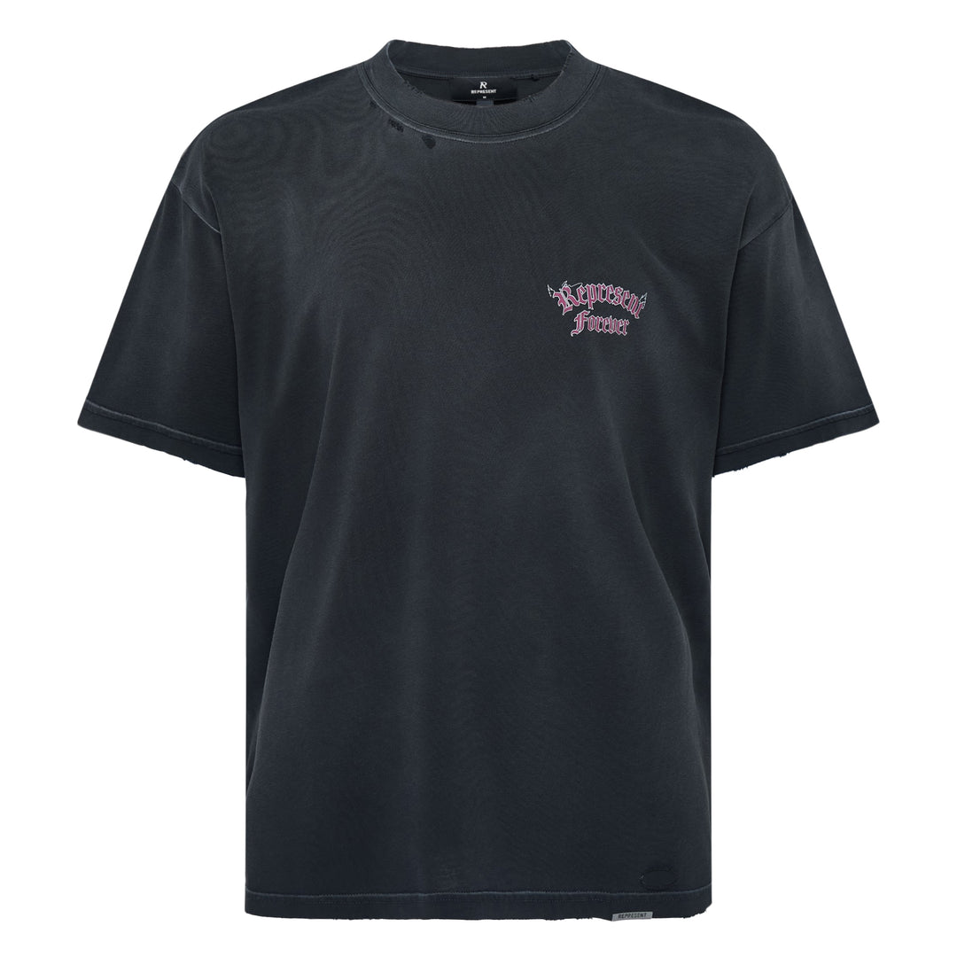 Back view of the Represent Duality Forever Graphic Tee in washed black, featuring gothic blackletter typography, winged lettering, and a mirrored skull heart graphic on a distressed oversized tee