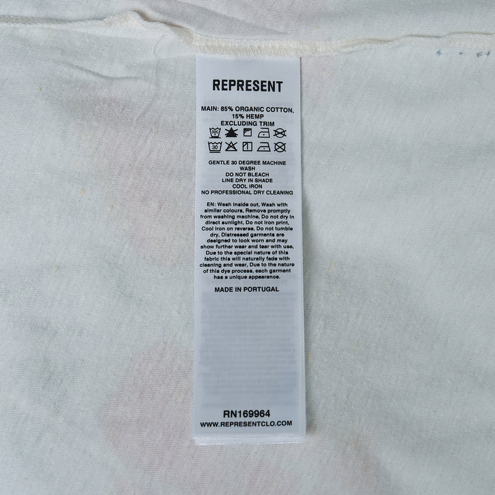 Represent x The Beach Boys Endless Summer white vintage-washed oversized graphic tee with retro surf-inspired chest print featuring clouds and a surfer figure
