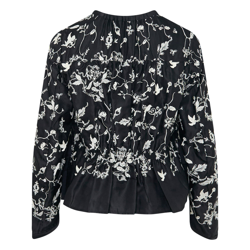 Renli Su long sleeve black blouse with ivory embroidered bird, key, and botanical motifs, gathered ruffle neckline, and drawstring cuff ties - view 2