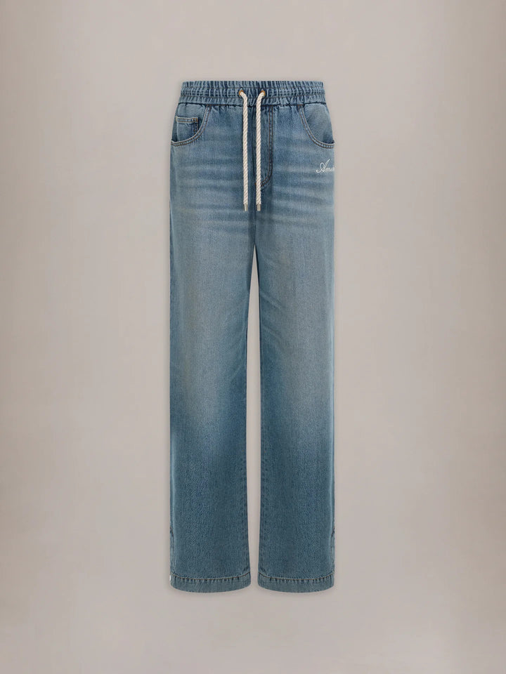 Amiri baggy drawstring jeans in washed light-blue denim with an elasticated waist, white rope drawcord and embroidered script logo at the hip